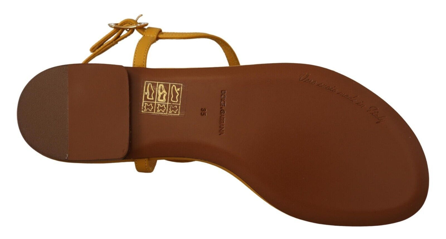 Dolce & Gabbana mustard yellow flat sandals with T-strap and heart embellishment