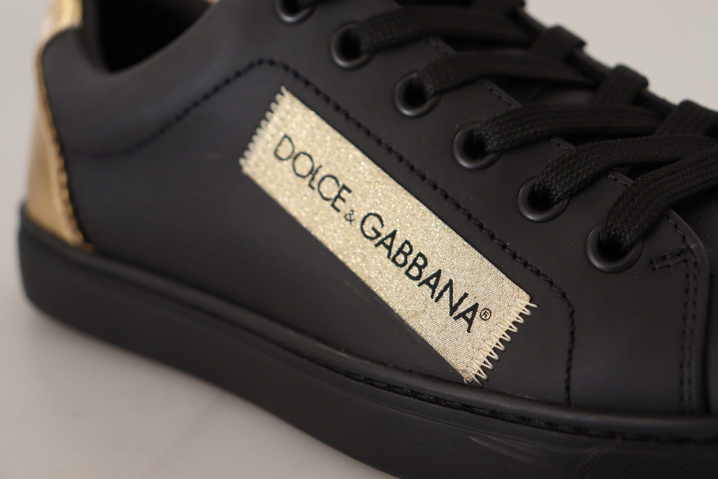 Dolce & Gabbana Schicke schwarz-goldene Low-Top-Ledersneakers