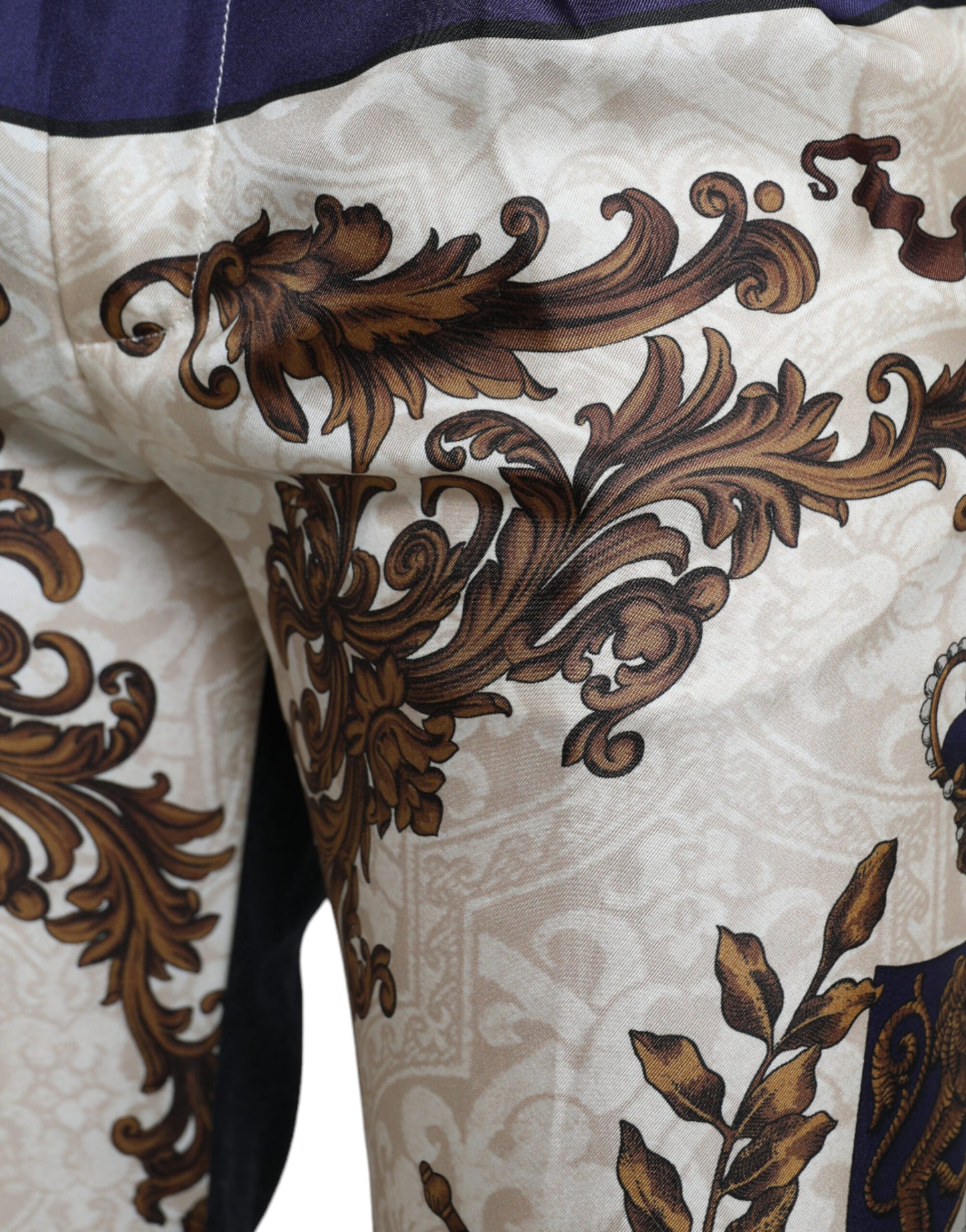 Dolce &amp; Gabbana Elegant skinny trousers made of silk with coat of arms print